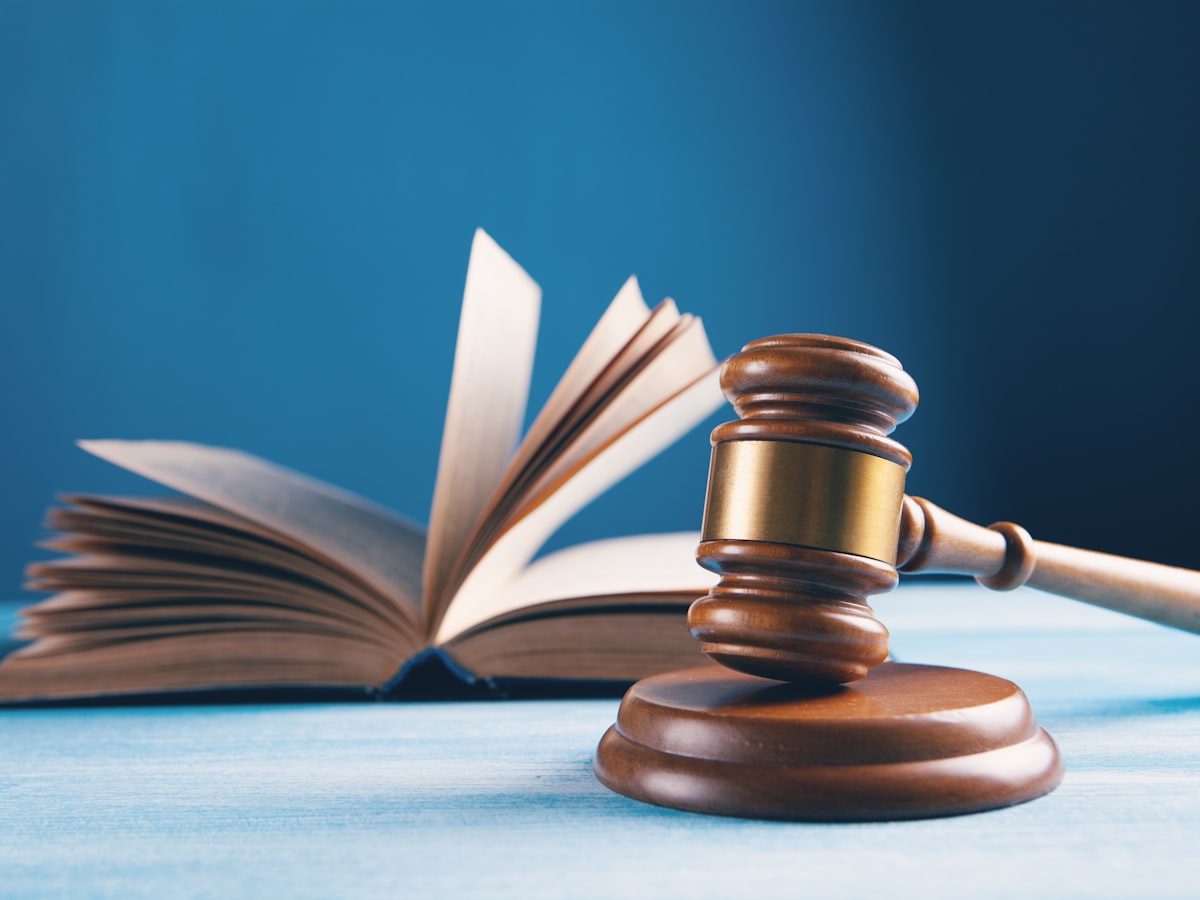 A judge's gavel resting in front of an open law book, representing the legal process behind Korea's jeonse-fraud special law