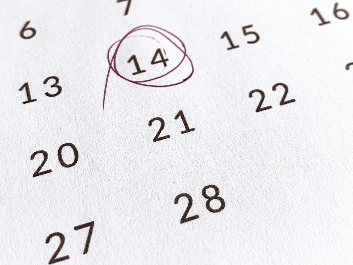 A calendar page with a date circled in dark red marker among the surrounding days
