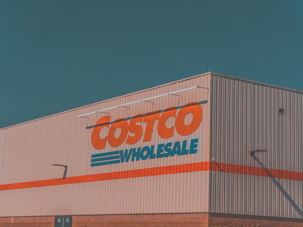 The exterior of a Costco Wholesale warehouse building with its logo on the facade