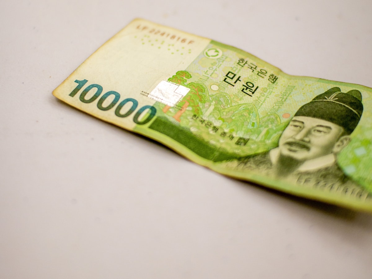 A Korean 10,000 won banknote lying on a plain surface