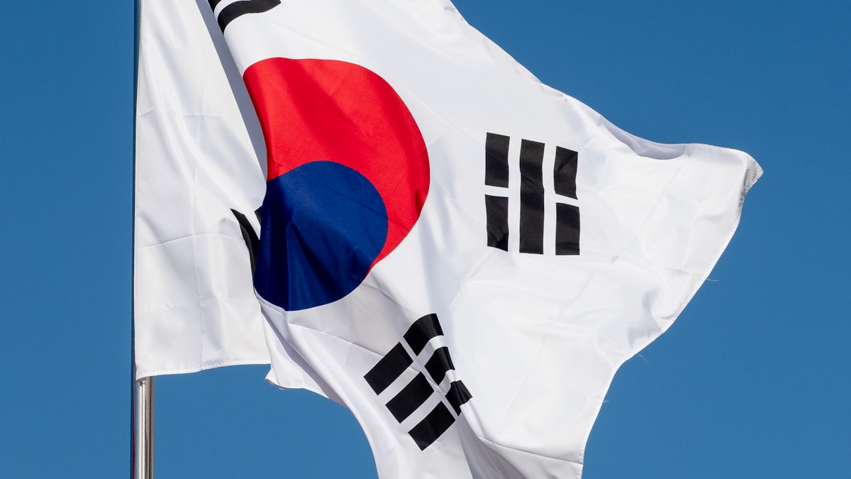 South Korea's Taegukgi flag rippling against a clear blue sky
